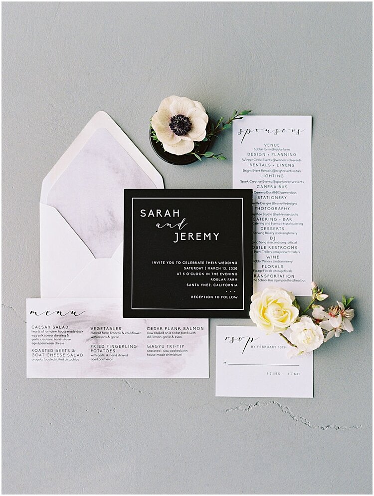 minimalist black and white wedding stationery flatlay